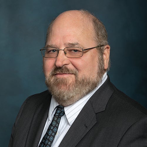headshot of John Sneider '94